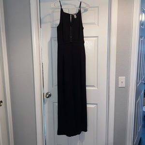 Black wide-leg Jumpsuit, size 6. Hardware up front.
